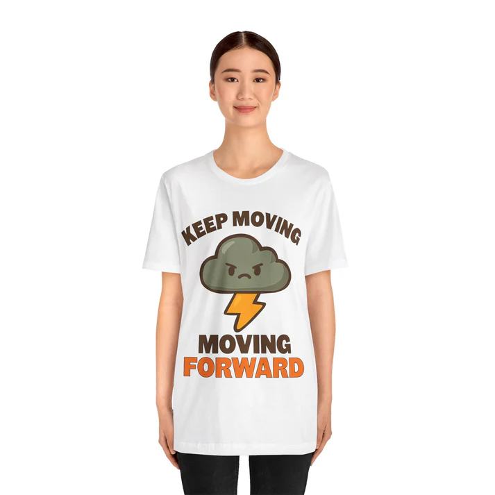 White t-shirt featuring the motivational phrase "KEEP MOVING FORWARD," accompanied by an angry cloud and lightning graphic, promoting resilience.